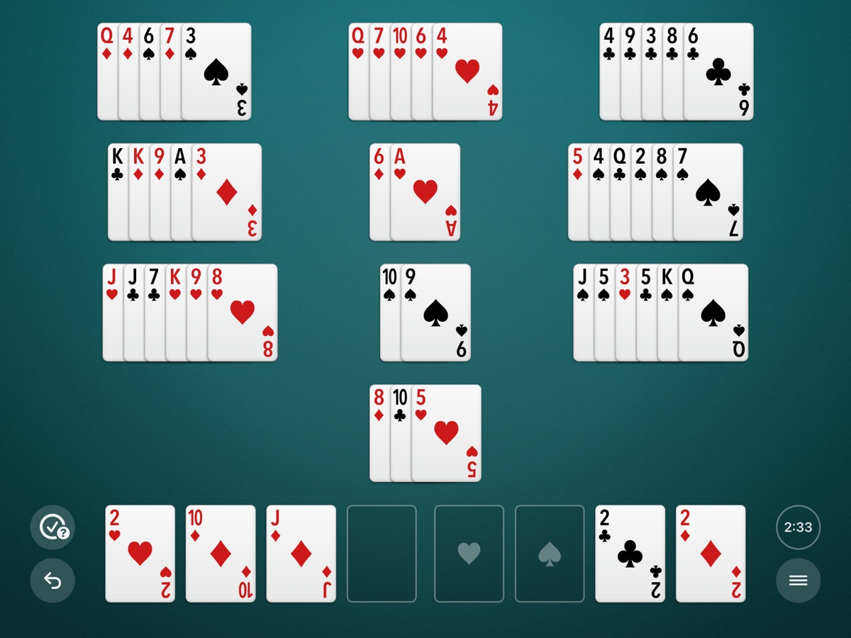 A game on an iPad turned sideways, on the teal table